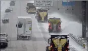  ?? GERRY BROOME — THE ASSOCIATED PRESS ?? Vehicles navigate hazardous driving conditions along Interstate 85/40as a winter storm moves through the area in Mebane, N.C., on Sunday.
