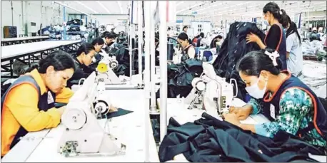  ?? TANG CHHIN SOTHY/AFP ?? A government report says the Kingdom’s garment industry generated $5.32 billion in the first eight months of this year.