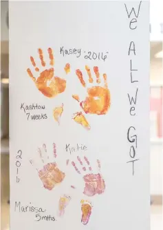  ??  ?? The handprints of incarcerat­ed mothers and their child’s footprints adorn the walls at the correction­al centre.