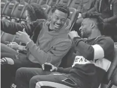  ?? JACK DEMPSEY/ASSOCIATED PRESS FILE PHOTO ?? Demaryius Thomas, left, and Emmanuel Sanders laugh Oct. 21 before the game between the Nuggets and the Warriors in Denver. Longtime Broncos player Thomas was traded Tuesday.