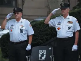  ?? MARIAN DENNIS — DIGITAL FIRST MEDIA ?? Montgomery County Commission­ers held a ceremony observing POW/MIA day. The event, held outside the Montgomery County courthouse served as a reminder of those who saw action and never returned home.