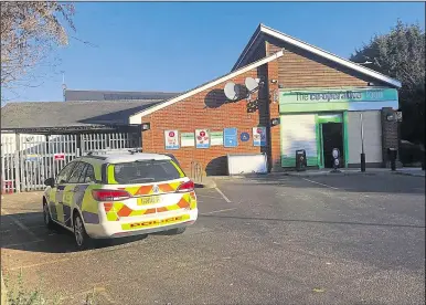  ??  ?? Police outside the Co-op following the robbery on Tuesday morning