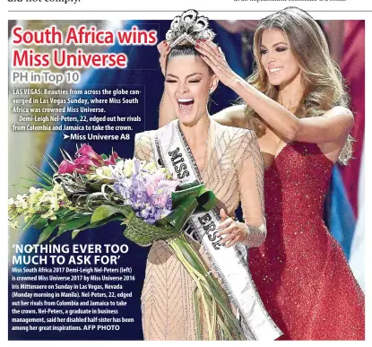  ?? AFP PHOTO ?? ‘NOTHING EVER TOO MUCH TO ASK FOR’ Miss South Africa 2017 Demi-Leigh Nel-Peters (left) is crowned Miss Universe 2017 by Miss Universe 2016 Iris Mittenaere on Sunday in Las Vegas, Nevada (Monday morning in Manila). Nel-Peters, 22, edged out her rivals...