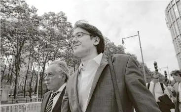  ?? Peter Foley / Bloomberg ?? Martin Shkreli, on trial on eight counts of securities and wire fraud, leaves federal court last week in Brooklyn with his attorney, Benjamin Brafman.