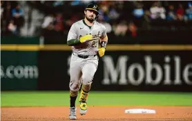  ?? Tony Gutierrez/Associated Press ?? The A’s Shea Langeliers rounds the bases after one of his three home runs against the Rangers on Tuesday in Arlington, Texas.