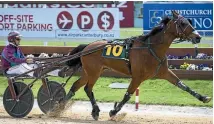  ?? PHOTO: JOSEPH JOHNSON/STUFF ?? Great Things Happen, in the hands of Gavin Smith, strides out to victory in the NZ Trotting Free-For-All at Addington yesterday.