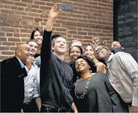  ?? Jeff Roberson Associated Press ?? FACEBOOK chief Mark Zuckerberg takes a selfie in St. Louis. The company also is launching the site Facebook for Creators to coach users on refining their videos.