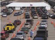  ?? Paul Ratje / AFP via Getty Images ?? Motorists line up for drivethrou­gh Covid19 tests at the University of Texas at El Paso on Friday.