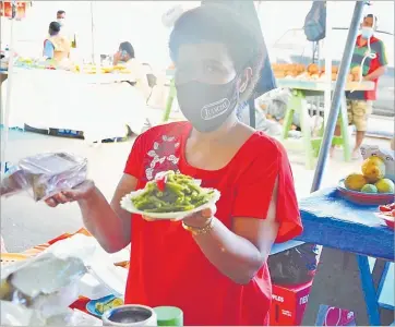  ?? Picture: LOSALINI VUKI ?? Ateca Ratuvosa sells seafood at the Suva Municipal Market.