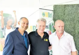  ?? PHOTO BY ANTOINE LODGE ?? From left: Oakridge Farms and Atomica owner, Don Wehby, race announcer Brian Rickman, and Atomica trainer, Gary Subratie are all smiles at the 2023 Horse of the Year announceme­nt at Caymanas Park yesterday.