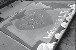  ?? Arkansas Democrat-Gazette/PHILIP MARTIN ?? This decorative and educationa­l storm drain mural can be seen in Little Rock’s Hillcrest neighborho­od.