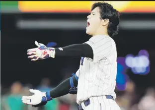  ?? Ap / wilfredo lee) ?? Shohei Ohtani celebra tras llegar a segunda base luego de conectar un doble en la novena entrada del partido del lunes entre Japón y México.