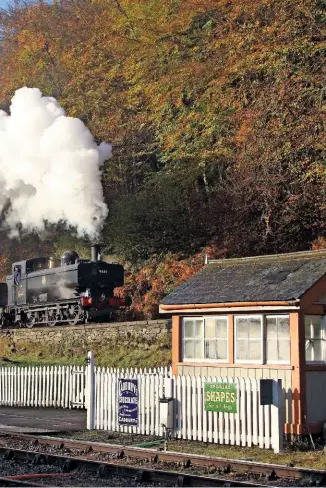  ?? IAN WHITEHEAD ?? BR-built ‘8750’ 0-6-0PT No. 9681 takes the ‘high level’ line past Norchard with a recreated ballast train during a Steamscene­s charter on November 7 2009. The ‘Dogfish’ hoppers are now being restored to 1950s black livery with appropriat­e markings.