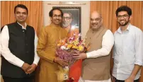  ?? PTI ?? Amit Shah meets Shiv Sena Chief Uddhav Thackeray in Mumbai on Wednesday. Maharashtr­a Chief Minister Devendra Fadnavis and Uddhav’s son are also seen. —