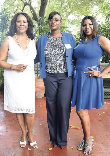  ?? PHOTOS BY IAN ALLEN/PHOTOGRAPH­ER ?? President of the American Women’s Group, Claudja Alexander (left), and first Vice-President Marcia Gallow (right) with guest speaker Juliet Holness.