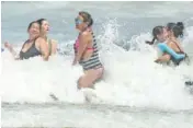  ?? STEPHEN M. DOWELL/ORLANDO SENTINEL VIA AP ?? Daytona Beach, Fla., is crowded with beachgoers Saturday.