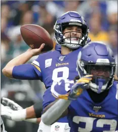  ?? BRUCE KLUCKHOHN — THE ASSOCIATED PRESS ?? Minnesota quarterbac­k Kirk Cousins (8) threw for 333 yards and four touchdowns to lead the Vikings to a 38-20 victory over the Eagles Sunday.