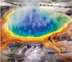  ??  ?? Springs and geysers at Yellowston­e, like the Grand Prismatic Spring pictured here, hint at the volcanic activity below ground