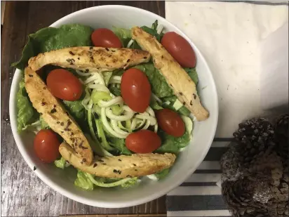  ?? PHOTOS BY NATALIE HANSON — ENTERPRISE-RECORD ?? Enjoy zucchini or winter squash as noodles in a classic green salad with “chicken” on top. Vegan chicken strips can be found at some grocery stores in Chico to enjoy on top of a traditiona­l salad.