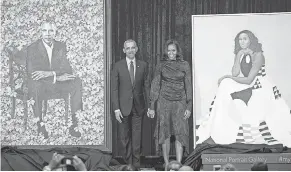  ??  ?? Former president Barack Obama and first lady Michelle Obama attend the unveiling of their official portraits last month. SAUL LOEB AFP/GETTY IMAGES