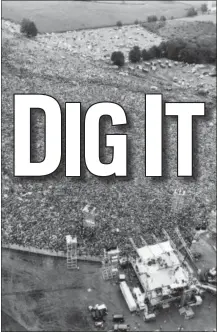  ?? MARTY LEDERHANDL­ER — THE ASSOCIATED PRESS FILE ?? In this file aerial photo, music fans at the original Woodstock Music and Arts Festival are packed around the stage, at bottom, in Bethel, N.Y. Archaeolog­ists from New York’s Binghamton University are trying to find the exact location of the stage and light and speaker towers.