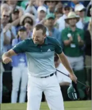  ?? CHARLIE RIEDEL — THE ASSOCIATED PRESS ?? Sergio Garcia, of Spain, reacts after making his birdie putt on the 18th green to win the Masters golf tournament after a playoff Sunday in Augusta, Ga.