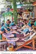  ??  ?? Visitors enjoy a street-side foot massage