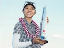  ?? PHOTO: GETTY IMAGES ?? That winning feeling . . . New Zealander Lydia Ko celebrates with the trophy after winning the Lotte Championsh­ip in Kapolei, Hawaii, yesterday.