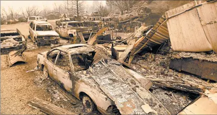  ?? JOSH EDELSON/GETTY-AFP ?? Burned vehicles smolder Tuesday at a residence in the Creek fire in an unincorpor­ated area of Fresno County, California.