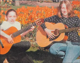  ?? ?? 1999: Two talented Campbeltow­n lasses went home from the Highlands & Islands Music & Dance Festival in Oban with prizes. Colleen Millar, left and Kirsten Millar each won their classes for folk song solo with guitar accompanim­ent.