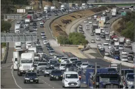  ?? FILE PHOTO ?? Rush-hour jams throughout California have become almost as time-consuming as prepandemi­c commuting delays.