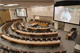  ?? (AP Photo/Mary Altaffer) ?? Pope Francis is seen on a video screen in an empty conference room at United Nations headquarte­rs as he speaks in a pre-recorded message addressing the 75th session of the United Nations General Assembly on Friday at the U.N.