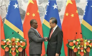  ??  ?? Chinese Foreign Minister Wang Yi (right), with Solomon Islands Foreign Minister Jeremiah Manele in September last year.