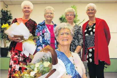  ?? PHOTO: JONO EDWARDS ?? Regal . . . Alexandra Blossom Festival Senior Queen Esther McKay takes her throne yesterday in front of other contestant­s (from left:) runnerup Margaret Ruffell, Shirley Bell, Mary Boyd and Jeanette McKay, all of Alexandra.