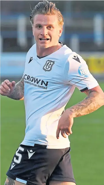  ??  ?? DOUBLE: Jason Cummings celebrates his second goal of the night in Dumfries.