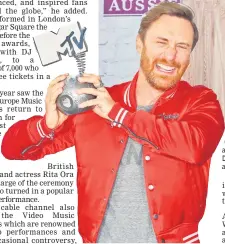  ??  ?? US-Cuban singer-songwriter Camila Cabello poses with the award for best pop act in the winners’ area.• (Inset) French DJ David Guetta poses with his best electronic act award.