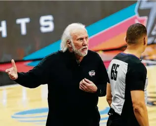 ?? Ronald Cortes / Getty Images ?? Spurs coach Gregg Popovich questioned Texas Gov. Greg Abbott’s decision to lift the statewide mask mandate despite health officials warning against easing restrictio­ns.