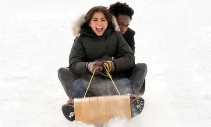  ?? Photograph: Steve Wilkie/Netflix ?? Isabela Merced and Shameik Moore muster up some festive cheer in Let It Snow.