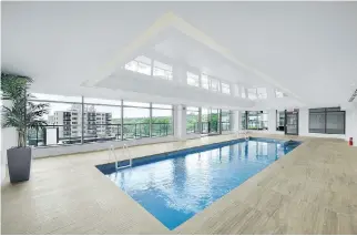  ??  ?? Amenities at Le 215 Redfern include a glass-enclosed rooftop saltwater pool and gym with the latest equipment.