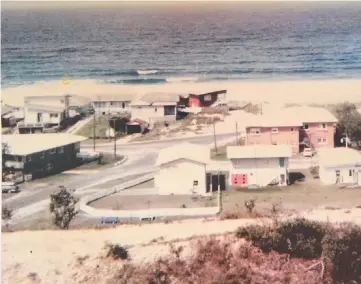  ??  ?? The view of the beach from Magic Mountain, Nobby Beach in 1969 and (below) Leon Williamson, (middle unded by her children Jan, Alan, Chris and Robyn holding Digger the dog. This photo was taken at Nobby Beach in September, 1969; and t7 Chairlift Ave East today.