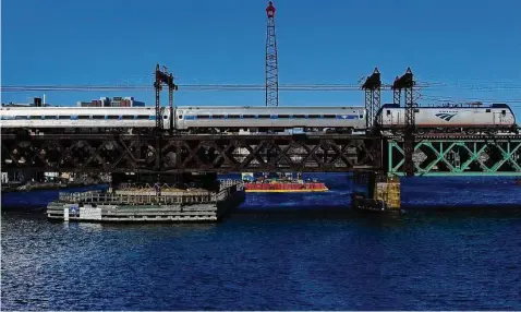  ?? Hearst Connecticu­t Media file photo ?? The Metro-North Railroad Walk Bridge on Jan. 28, 2021, in Norwalk. Bridge replacemen­t operations are expected to begin with a large dredging operation planned for the head of the Norwalk River.