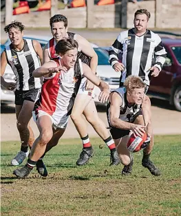  ?? ?? Nyora’s Lachie Fievez prepares to tackle Poowong’s Alex Henshall.