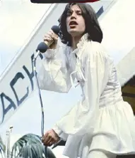  ??  ?? Mick Jagger performs in a dress by ‘60s label Mr. Fish.