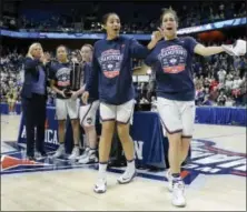  ?? JESSICA HILL — THE ASSOCIATED PRESS ?? UConn’s Gabby Williams and Kia Nurse playfully react during Monday’s AAC championsh­ip trophy ceremony.