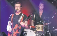  ??  ?? Jesse Hughes, left, and Josh Homme of Eagles of Death Metal performing at the Teragram Ballroom on Oct 19, in Los Angeles.