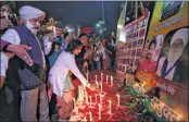  ?? —ANI ?? Farmers hold a candleligh­t vigil on the 2nd anniversar­y of Pulwama attack to pay their tributes to martyrs at Ghazipur border.