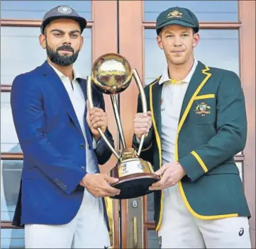  ?? AFP ?? ■ Australia captain Tim Paine (right) and India skipper Virat Kohli pose with the Border-Gavaskar Trophy ahead of the first Test starting at the Adelaide Oval from Thursday. India have won only one of their 11 Tests at this venue.