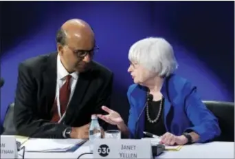  ?? AP PHOTO — JOSE LUIS MAGANA ?? U.S. Federal Reserve Chair Janet Yellen speaks with G30 Chairman Singapore Deputy Prime Minister Tharman Shanmugara­tnam during the G30 Internatio­nal Banking Seminar, at Inter-American Developmen­t Bank headquarte­rs in Washington, Sunday.