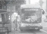  ?? Cody Duty / Houston Chronicle file ?? Come March, natural gas-operated GreenLink buses like this one along Smith Street will add nights and weekends to their shifts.