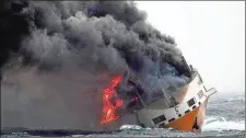  ?? MARINE NATIONALE ?? The Grimaldi vessel Grande America burns in the Bay of Biscay, off the west coast of France on March 11. Rescue teams saved all 27 people aboard the Grande America tanker after it sank.